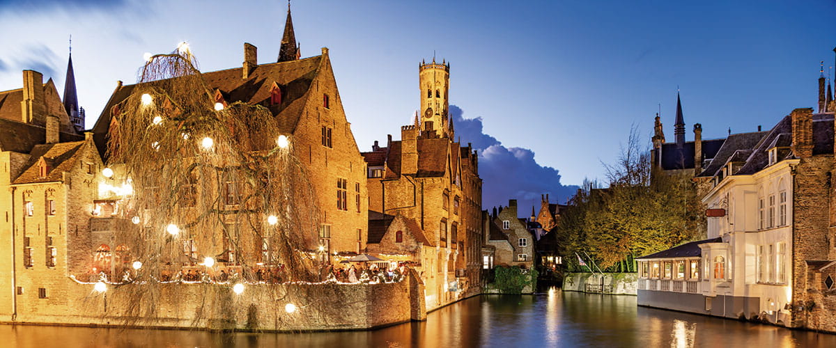 The canals of Bruges illuminated with Christmas lights in the evening, Belgium